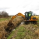 Ditch clearing near buried pipelines